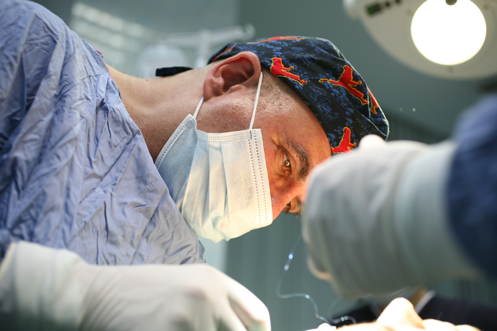 Mr Ardeshire Vahidi operating in theatre